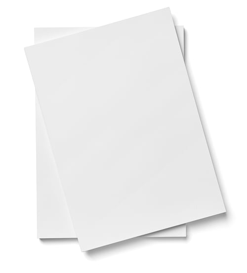 close up of stack of papers on white background